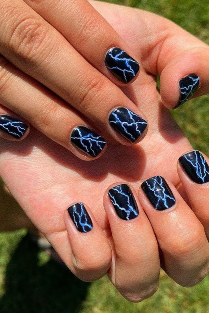 Neon blue circuitry inspired nail design