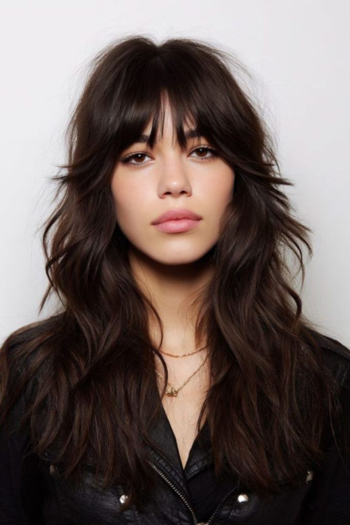 Feathered layers framing oval face