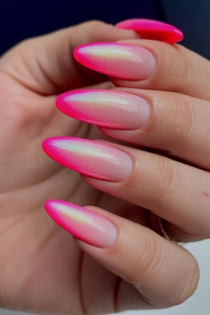 Vibrant bubble-pink stiletto glitter tips.