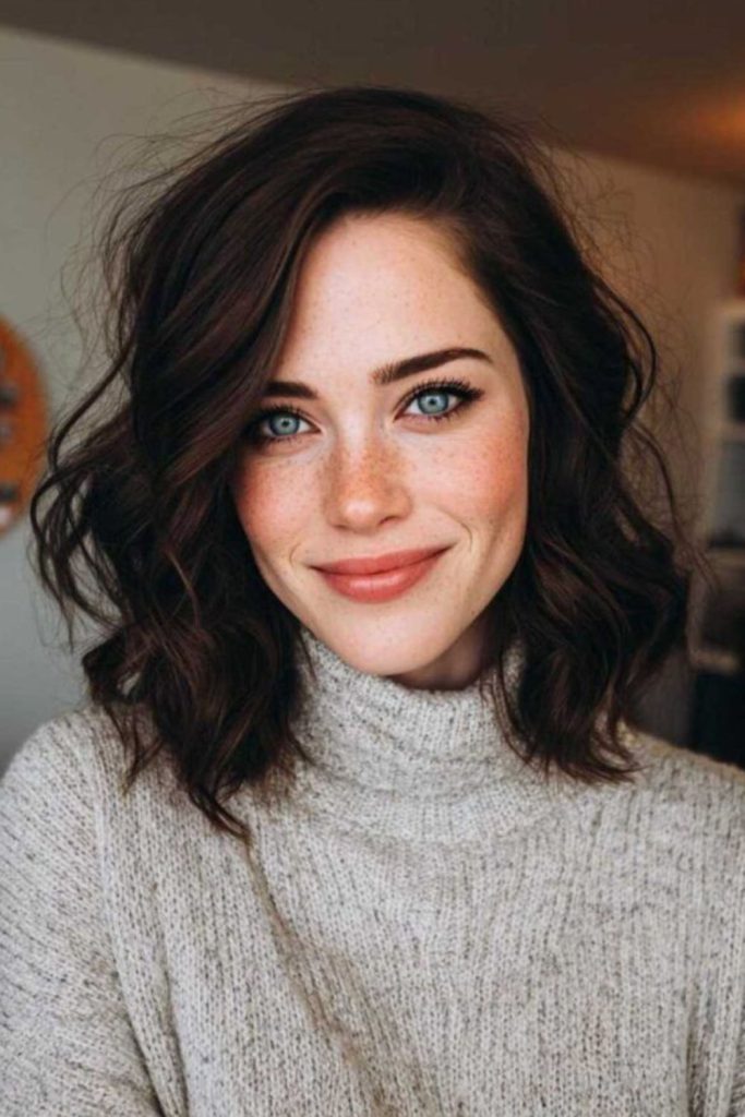 Midi cut with airy face framing.