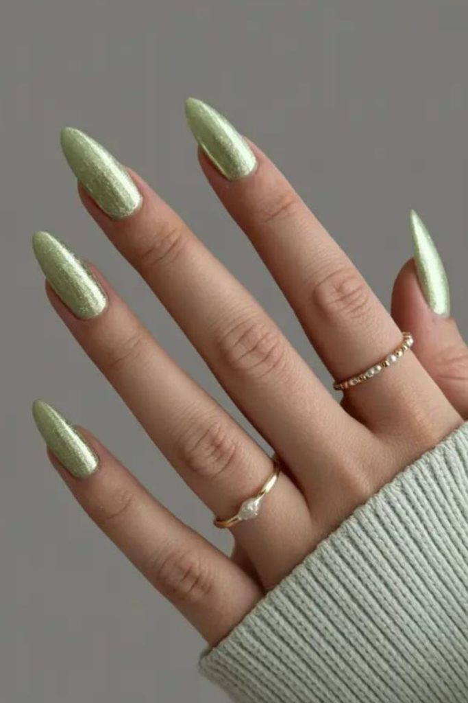 Light green nails with golden sparkle