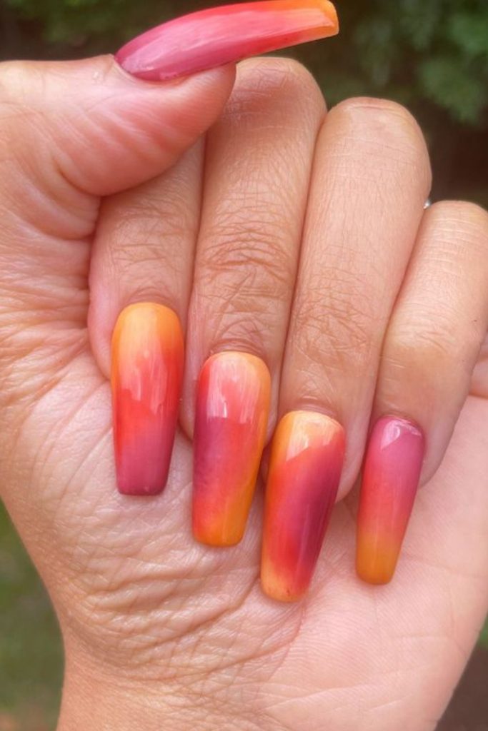 Tangerine yellow nails with sunrise gradient