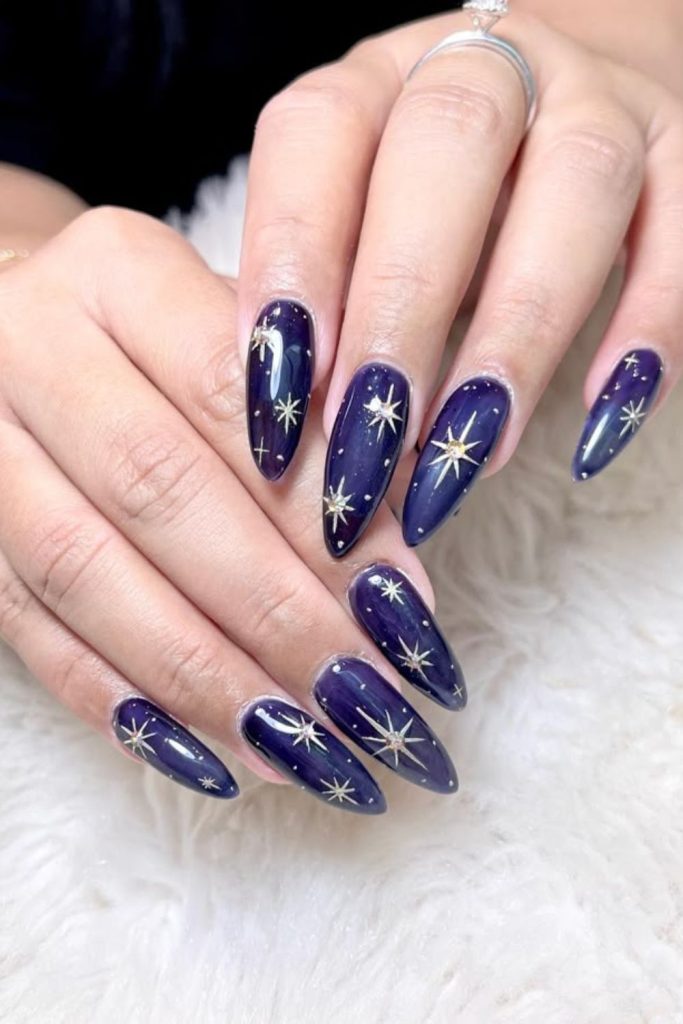 Dark violet nails with holographic stars