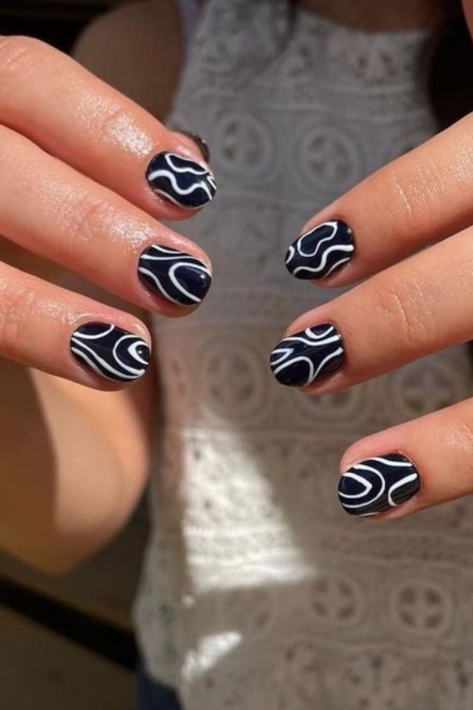 Tribal black swirls tiny nail art