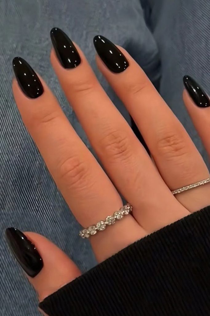 Deep black nails, mysterious sleek style.