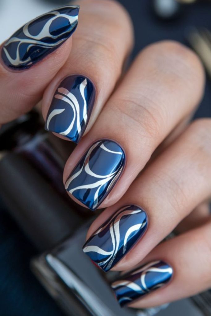 Dark blue nails with silver veins.