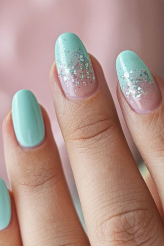 Mint green nails with glitter
