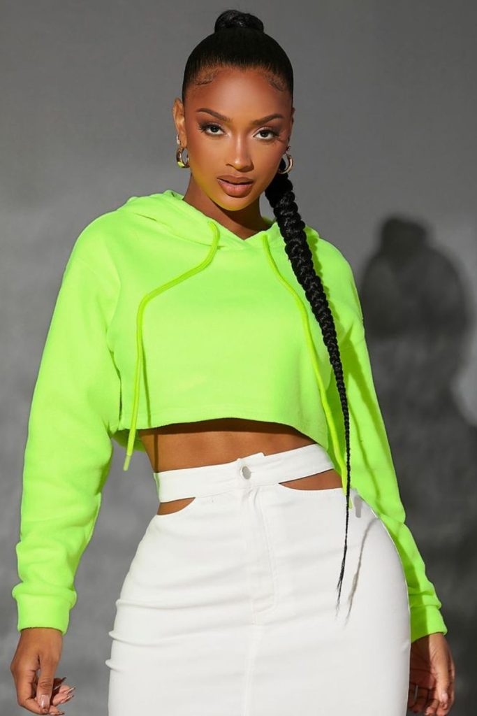 Neon cropped hoodie vinyl skirt sneakers vibe
