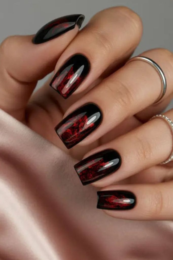 Black nails with curling red roses