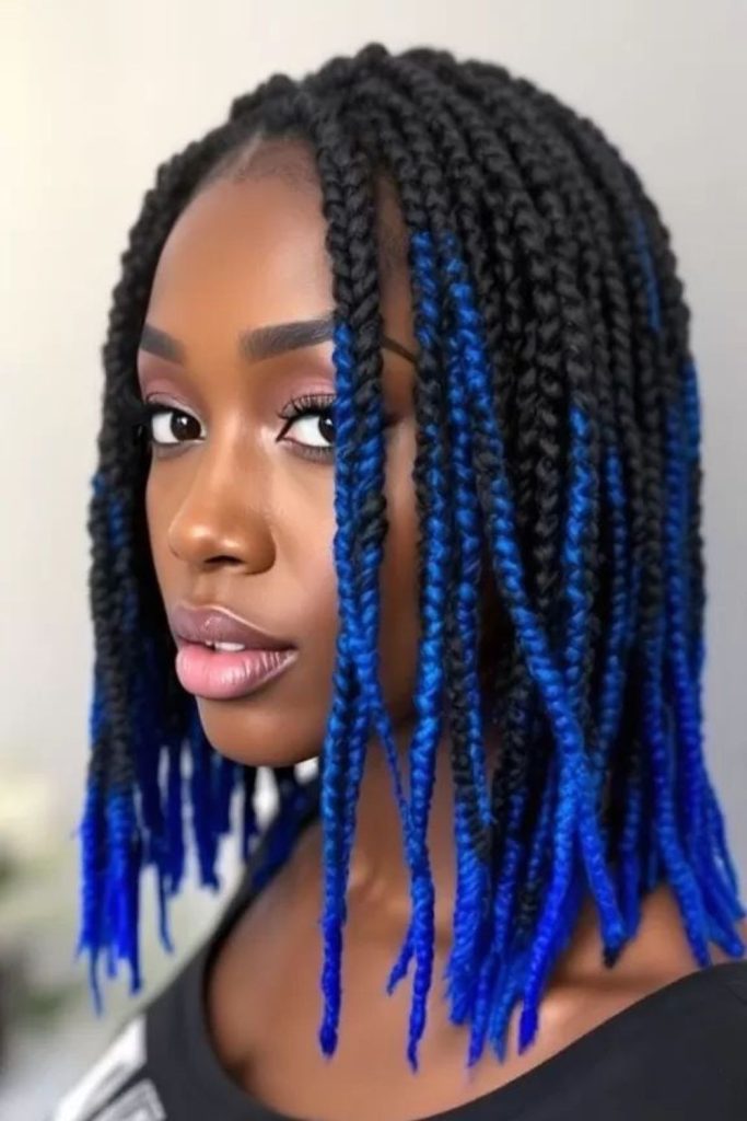 Blue-accented braids with shell charms