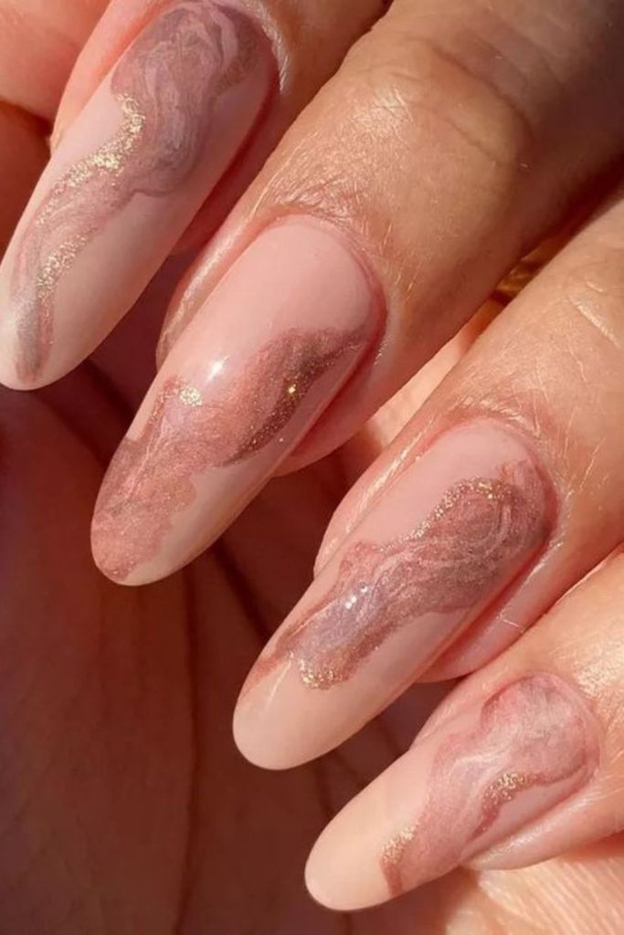 Rose quartz nails with gold highlights