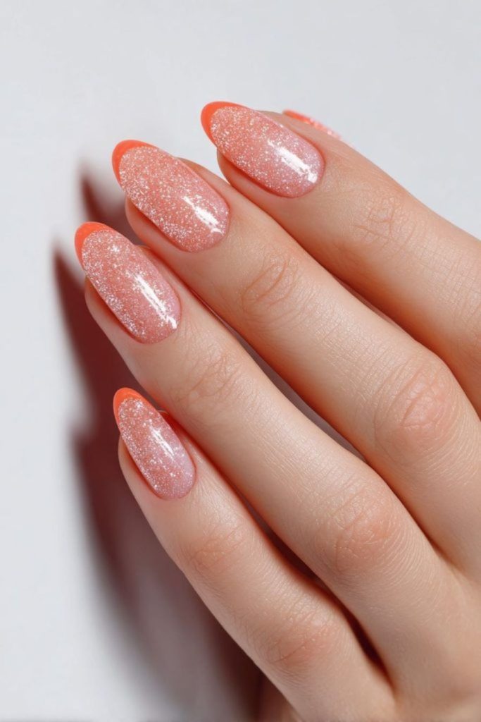 Peach floral nails with subtle shimmer.