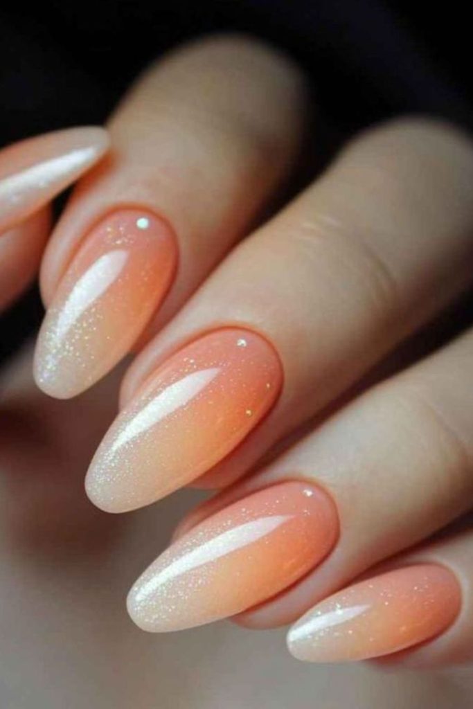 Apricot nails with reflective shimmer