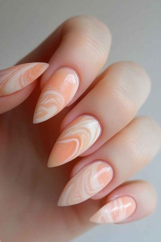 Pale peach nails with cream swirls