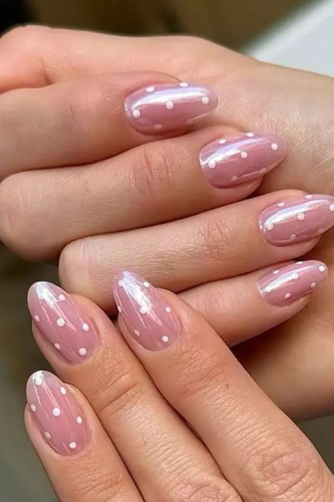 Soft pink nails with silver dots