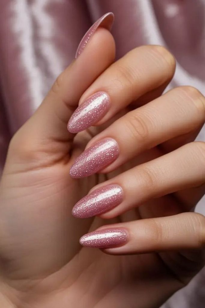 Dusty pink nails with ethereal shimmer.