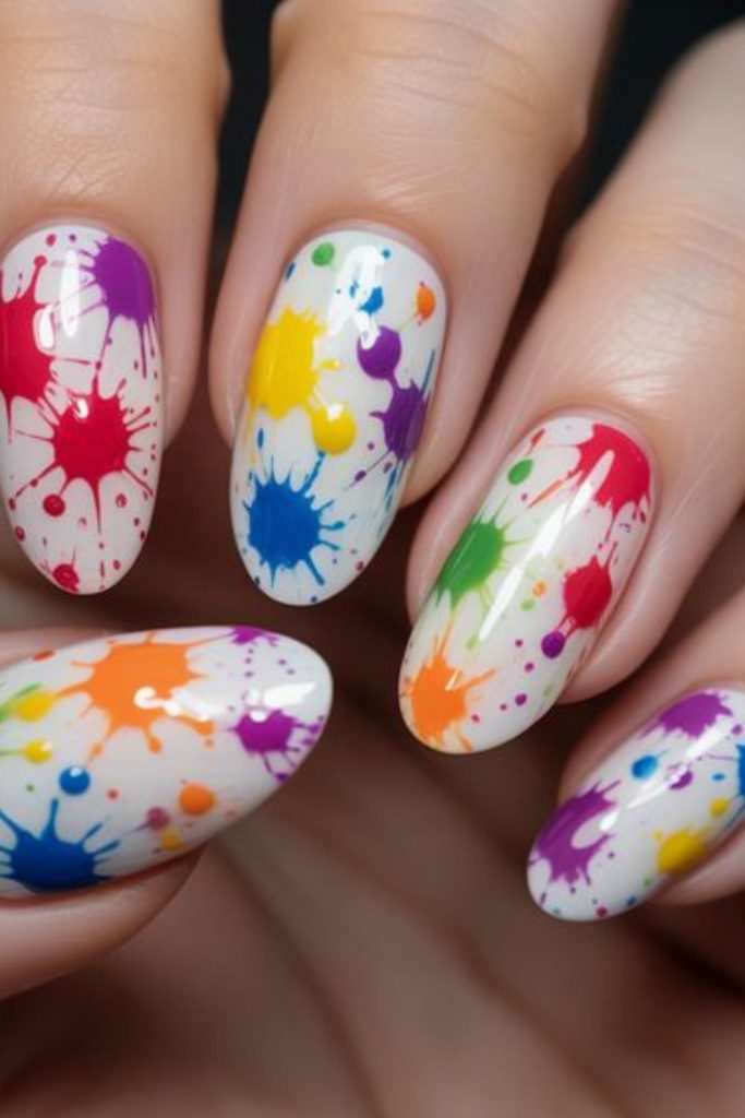 White nails with multicolor festive splashes