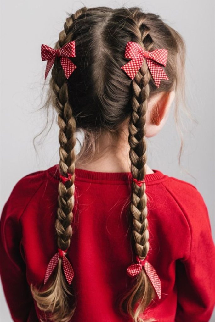 Braided pigtails accented with fluttering ribbons