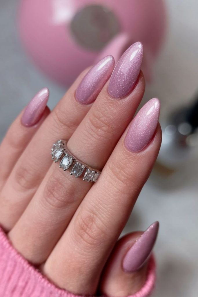 Soft rose nails with scattered shimmer.