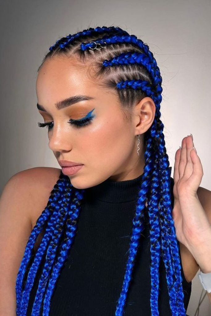 Blue braids cascading over shoulders