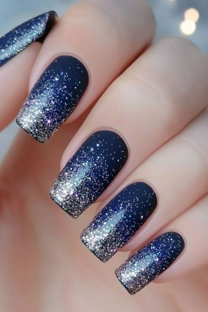 Deep sapphire nails with silver streaks.