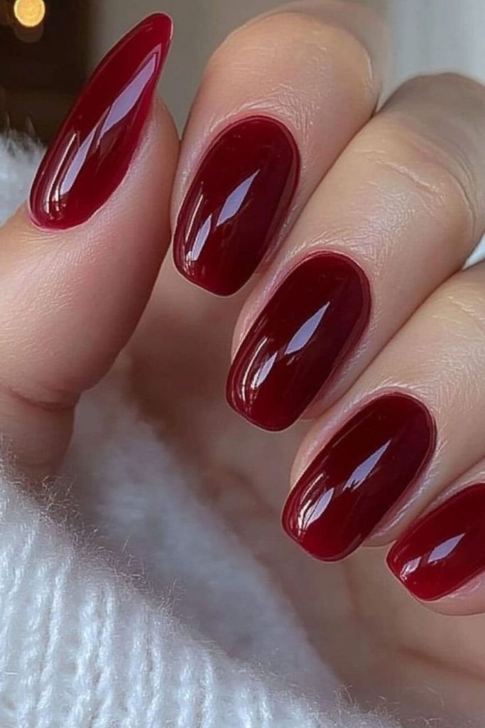 Scarlet nails, subtle fiery elegance.