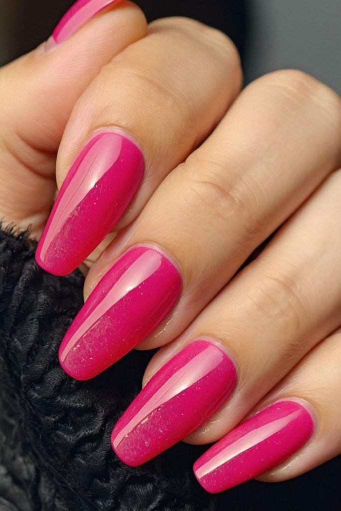 Juicy pink drip nails with sparkle.