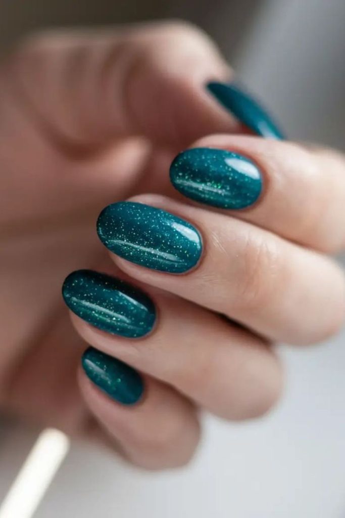 Teal nails, mystical ocean-like hue.