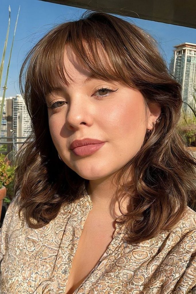 Lob with curtain fringe softens face