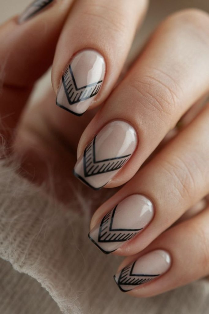 Mini chevrons scattered across soft nails