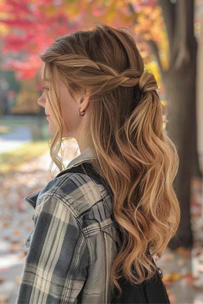 Half-ponytail twisted with loose tendrils