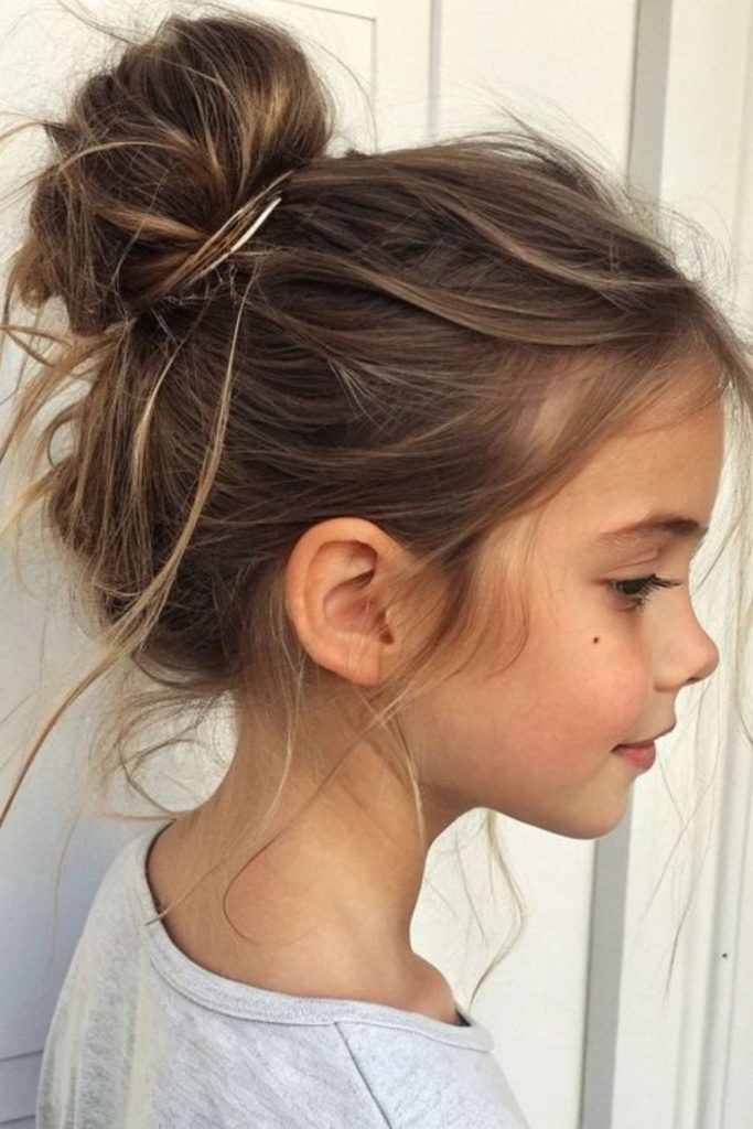 High twisted top knot with strands