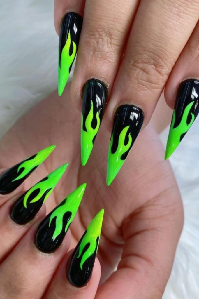 Neon green flames on black nails.