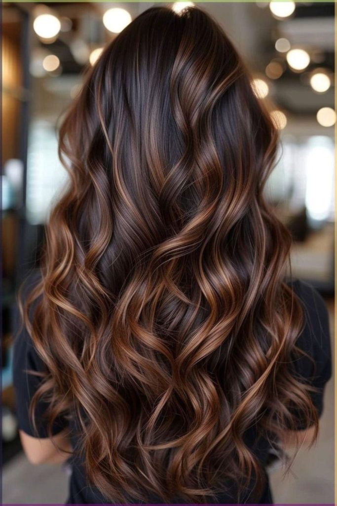 Amber shine flowing in cocoa brown hair.