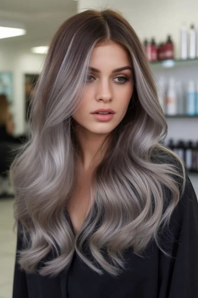 Hidden ash highlights dark hair.