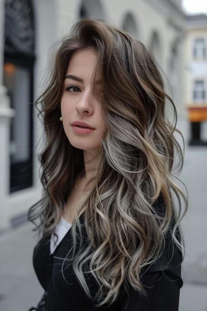 Ash brown hair with cool toned highlights.
