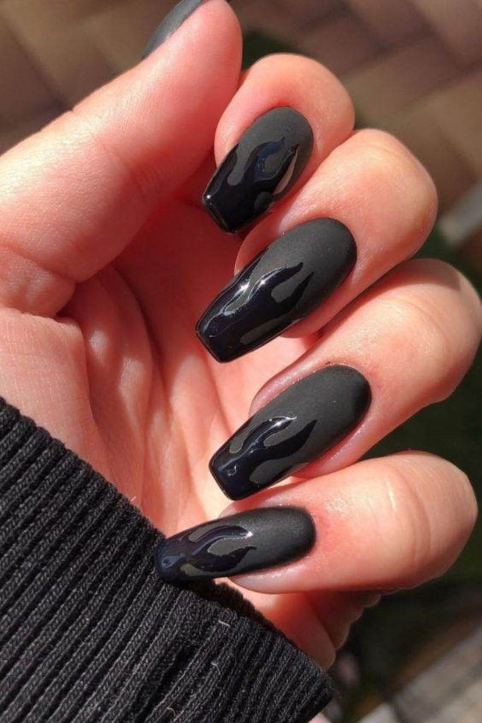 Matte black nails with subtle flames.