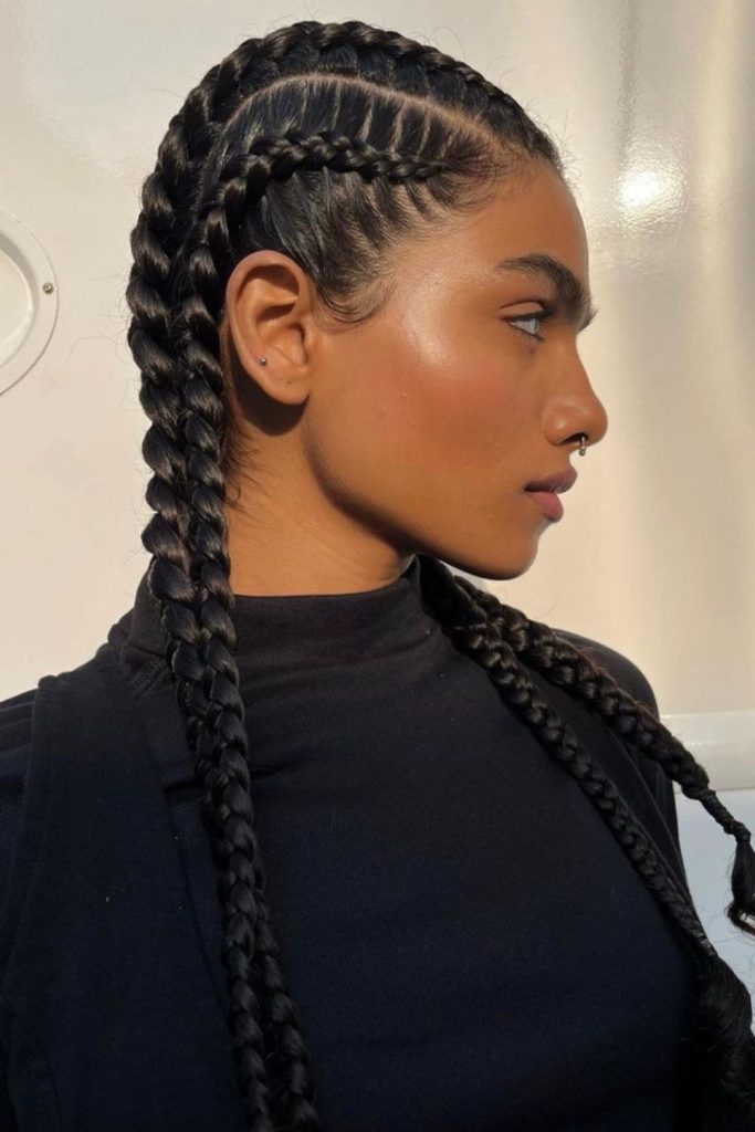 Bold warrior thick straight back braids.