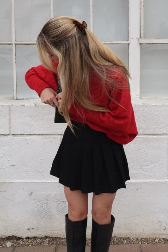 Red sweater black skirt outfit.