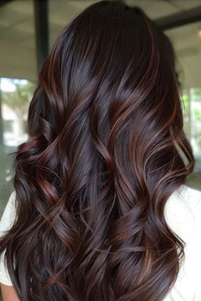 Amber silk highlights on cocoa brown hair.