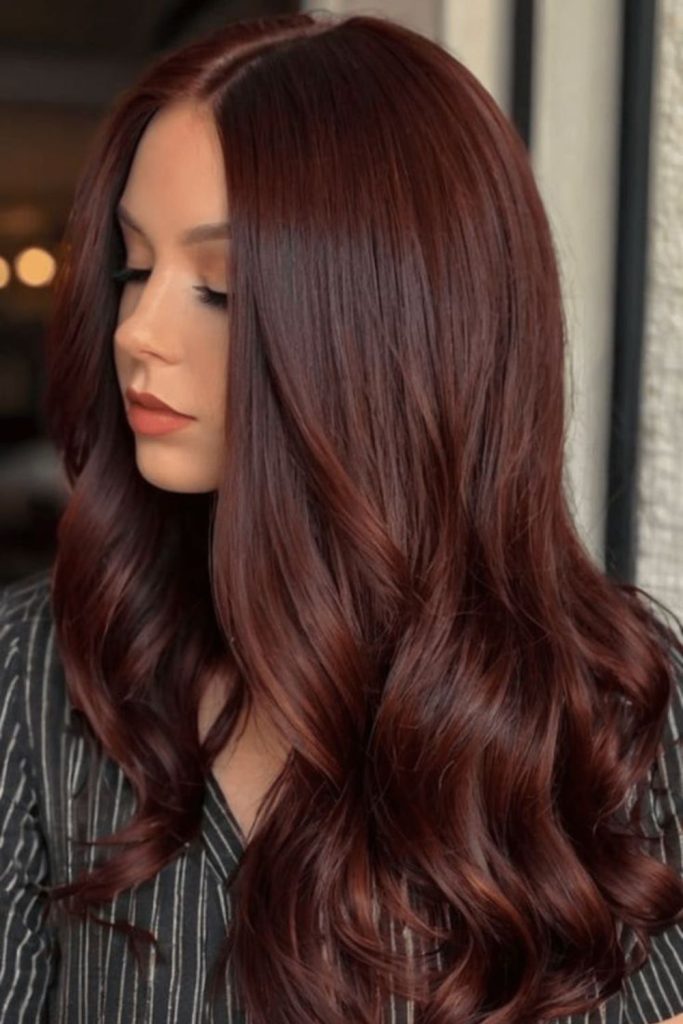 Copper ember highlighted brown textured hair.