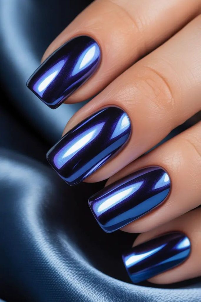 Deep navy nails with glass-like shards