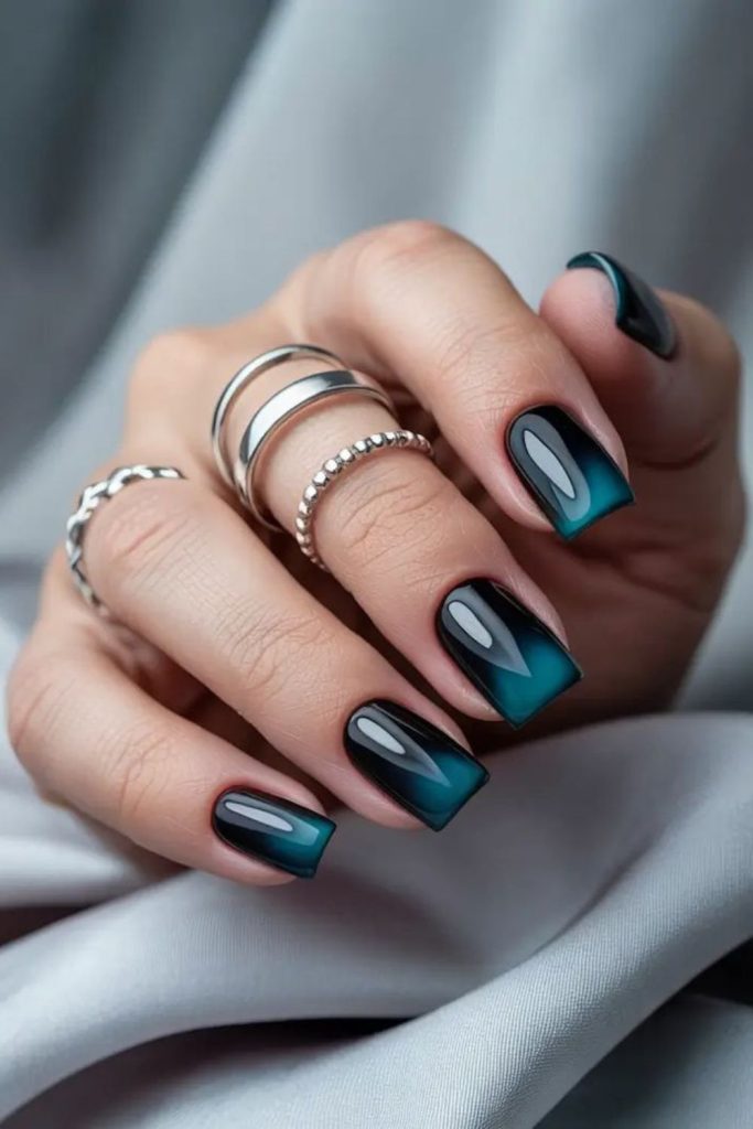 Electric cyan streaked black tech nails