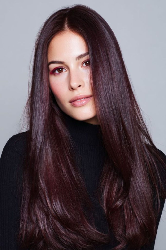 Dark cherry sleek red brown hair.