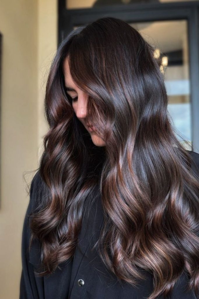 Cinnamon waves in espresso dark brown hair.