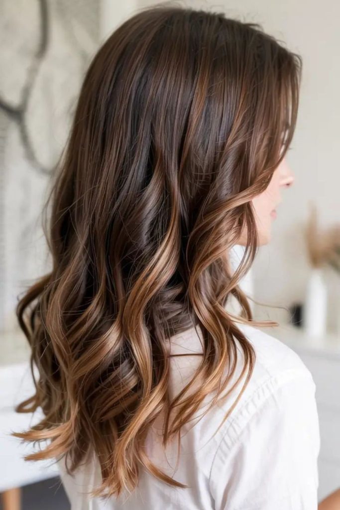 Espresso brown hair with creamy contrast highlights.