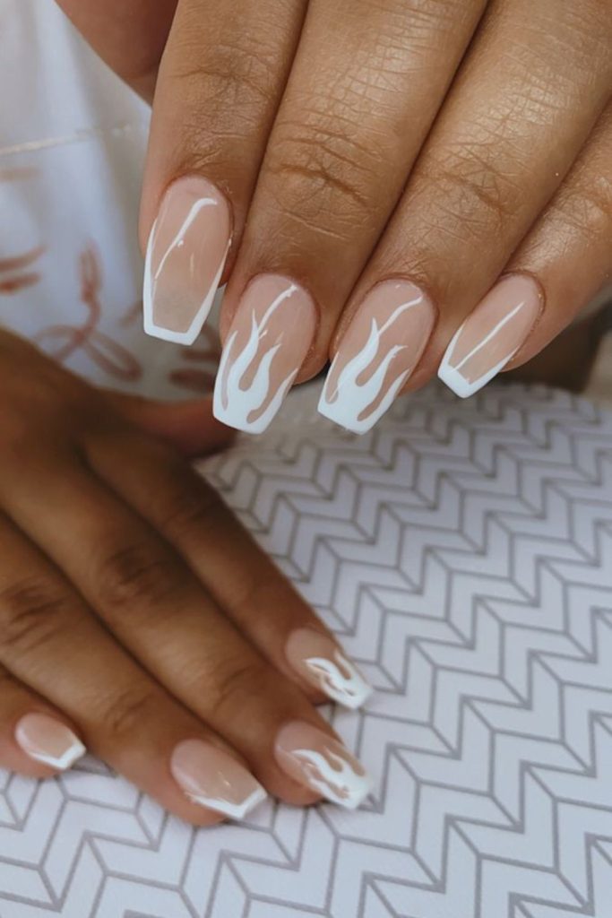 Thin flame outlines on clear nails.