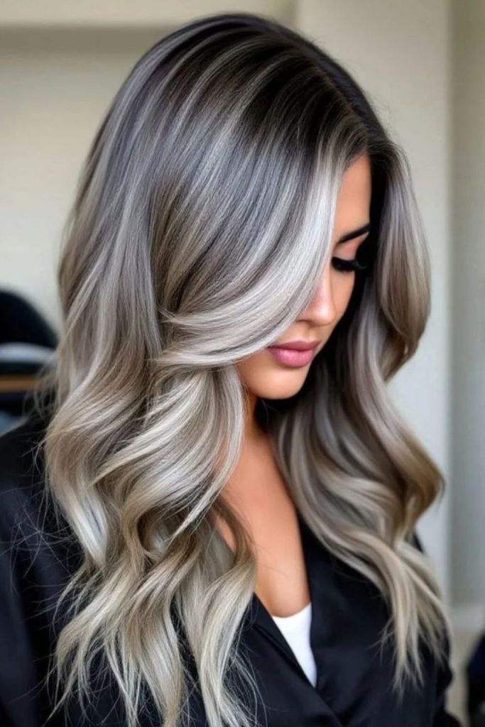 Ash blonde balayage on dark hair.