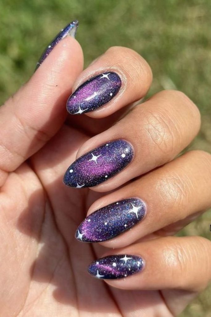 Purple nails with iridescent star flecks