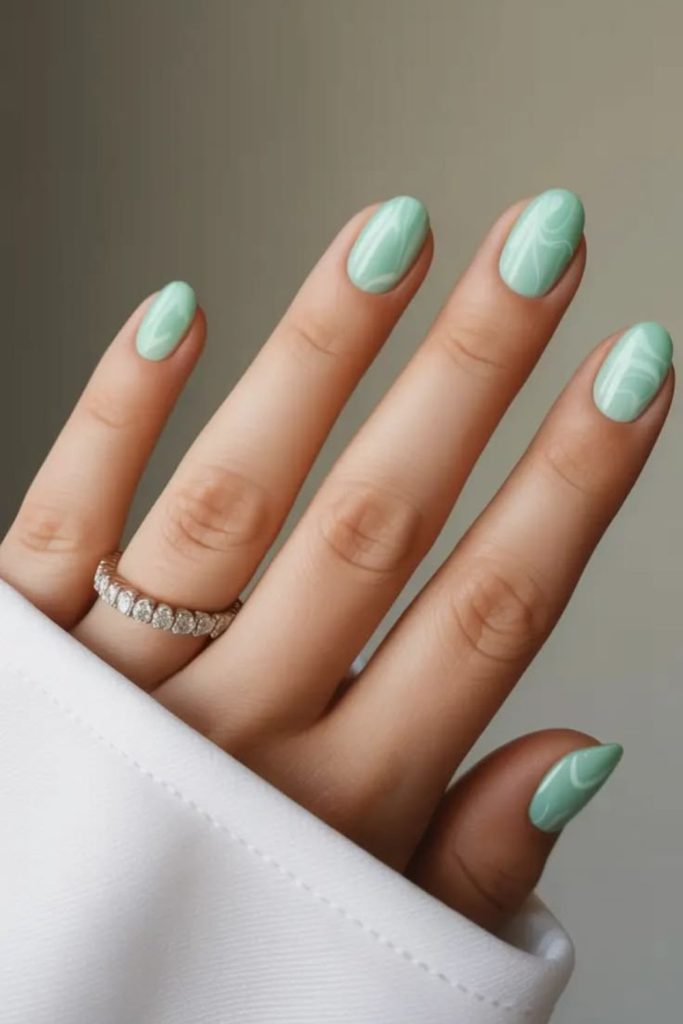 Icy mint nails with subtle shine.